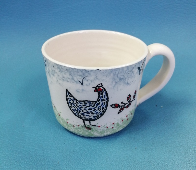Hand thrown and hand decorated Farmyard Chicken cup