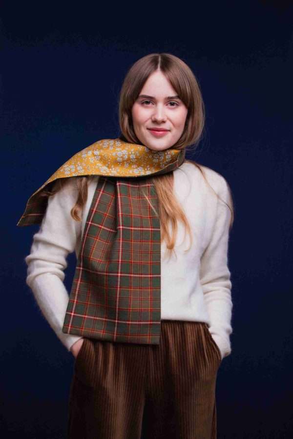 LoullyMakes Studio 4 37 scaled Classic Long scarf in our own exclusive Flodden Commemorative tartan with Liberty Print tana lawn cotton lining, carefully designed and handmade in Scotland by LoullyMakes . Simply select your choice of printed art fabric lining from the drop-down menu. ( The example long scarf pictured here features lining 3 ) 100% Wool Tartan, 100% cotton lining