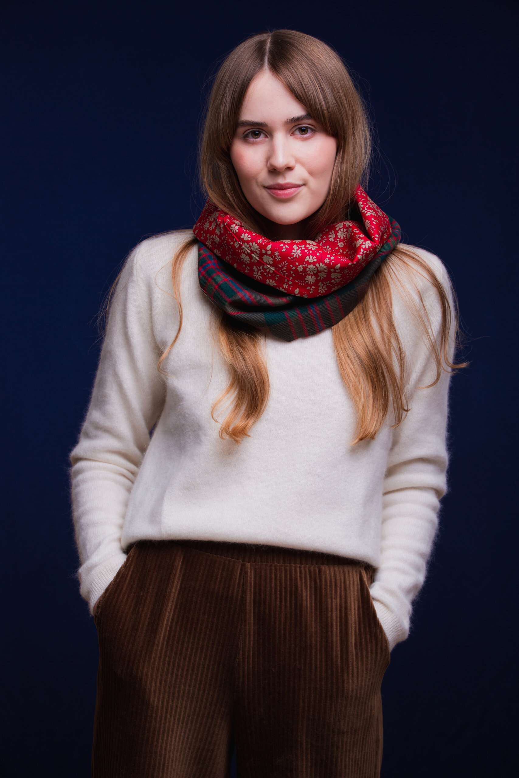 LoullyMakes Studio 4 52 scaled Classic Cowl in our own exclusive John Muir Way Tartan with Liberty Print tana lawn cotton lining. Simply select your choice of coloured lining from the drop-down menu. ( The example cowl pictured here features lining 5 ) This easy-to-wear cowl combines effortless styling and sublime warmth, being formed from a simple superfine cotton lined "tube" of 100% wool John Muir Way Tartan. Simply pop over your head and wear the cowl high, to keep out the chill, or roll over the neckline to feature a flourish of an iconic art fabric. 100% Wool Tartan, 100% cotton lining