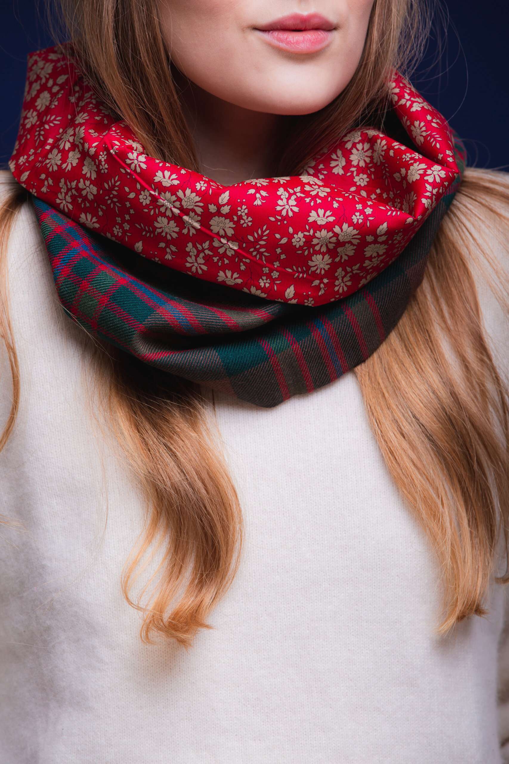 LoullyMakes Studio 4 53 scaled Classic Cowl in our own exclusive John Muir Way Tartan with Liberty Print tana lawn cotton lining. Simply select your choice of coloured lining from the drop-down menu. ( The example cowl pictured here features lining 5 ) This easy-to-wear cowl combines effortless styling and sublime warmth, being formed from a simple superfine cotton lined "tube" of 100% wool John Muir Way Tartan. Simply pop over your head and wear the cowl high, to keep out the chill, or roll over the neckline to feature a flourish of an iconic art fabric. 100% Wool Tartan, 100% cotton lining