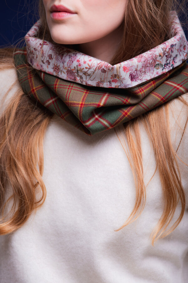 LoullyMakes Studio 4 59 scaled Classic Cowl in our own exclusive Flodden Commemorative Tartan with Liberty Print tana lawn cotton lining. Simply select your choice of coloured lining from the drop-down menu. (The example cowl pictured here features lining 6) This easy-to-wear cowl combines effortless styling and sublime warmth, being formed from a simple superfine cotton lined "tube" of 100% wool Flodden Tartan. Simply pop over your head and wear the cowl high, to keep out the chill, or roll over the neckline to feature a flourish of an iconic art fabric. 100% Wool Tartan, 100% cotton lining
