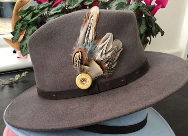 WhatsApp Image 2021 01 29 at 09.12.41 1 Warm Grey wool felt fedora hat with feather pin. My wool felt fedora hats are beautifully made, water resistant & come complete with a detachable natural game feather pin. Available in sizes; Extra small 53-54cm,  Small 55-56cm & Medium 57-59cm The fedora hat is made from 100% wool felt and suitable to be worn in all weathers.  If the hat does get wet just leave it to dry flat & naturally.