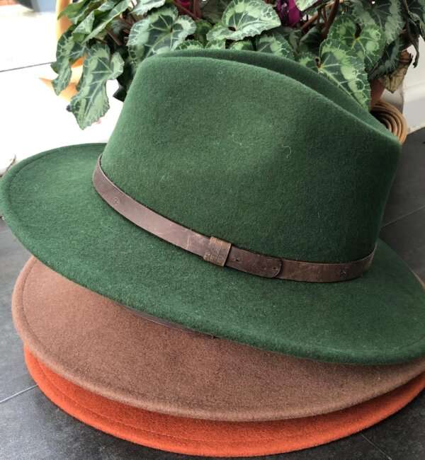 WhatsApp Image 2021 01 29 at 09.12.45 1 Green wool felt fedora hat with feather pin. My wool felt fedora hats are beautifully made, water resistant & come complete with a detachable natural game feather pin. Available in sizes; Extra small 53-54cm,  Small 55-56cm & Medium 57-59cm The fedora hat is made from 100% wool felt and suitable to be worn in all weathers.  If the hat does get wet just leave it to dry flat & naturally.