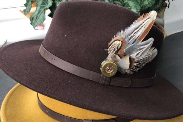 WhatsApp Image 2021 01 29 at 09.12.45 Dark Brown wool felt fedora hat with feather pin. My wool felt fedora hats are beautifully made, water resistant & come complete with a detachable natural game feather pin. Available in sizes; Extra small 53-54cm,  Small 55-56cm & Medium 57-59cm The fedora hat is made from 100% wool felt and suitable to be worn in all weathers.  If the hat does get wet just leave it to dry flat & naturally.
