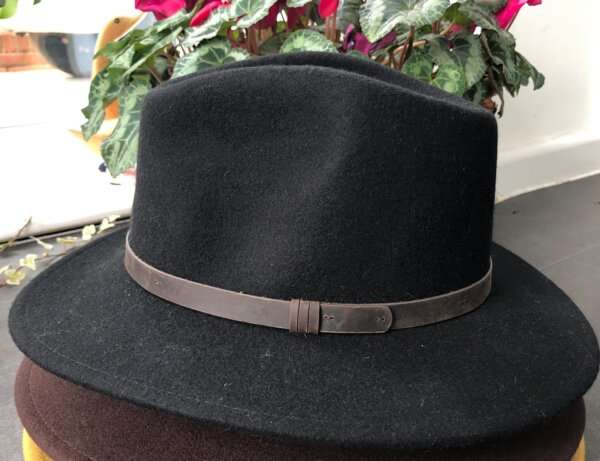 WhatsApp Image 2021 01 29 at 09.12.48 1 Black wool felt fedora hat with feather pin. My wool felt fedora hats are beautifully made, water resistant & come complete with a detachable natural game feather pin. Available in sizes; Extra small 53-54cm,  Small 55-56cm & Medium 57-59cm The fedora hat is made from 100% wool felt and suitable to be worn in all weathers.  If the hat does get wet just leave it to dry flat & naturally.