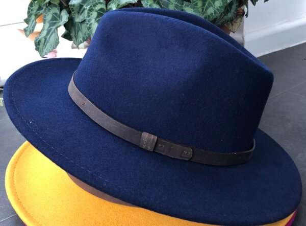 WhatsApp Image 2021 01 29 at 09.12.51 1 Bright Blue wool felt fedora hat with feather pin. My wool felt fedora hats are beautifully made, water resistant & come complete with a detachable natural game feather pin. Available in sizes; Extra small 53-54cm,  Small 55-56cm & Medium 57-59cm The fedora hat is made from 100% wool felt and suitable to be worn in all weathers.  If the hat does get wet just leave it to dry flat & naturally.