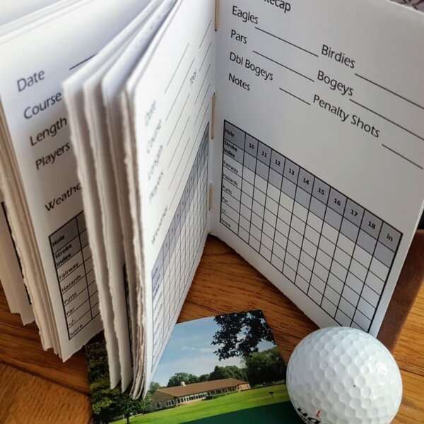 hand torn pages with golf score chart