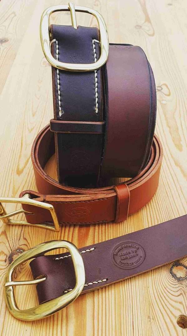 20210206 210351 scaled Hand-crafted leather belt. Made-to-measure from the finest English full grain leather. Hand-stitched. Leather colour: black, dark brown, chestnut, tan, or natural. Solid brass or nickel-plated buckle. Personalise - add embossed lettering for no additional cost. Eg, initials, name, nickname.