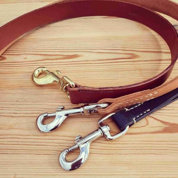 IMG 20210207 192637 984 scaled Hand-crafted leather clip lead, made from the finest English, full grain leather. - Hand-stitched - Solid brass or nickel swivel clip - Available in black, chestnut, dark brown, tan and natural colour leather - Length: Standard (38 inches), Long (48 inches). Width: 1 inch - Can be personalised with your initials, your name, or your dogs name for no additional cost.