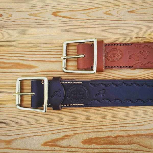 IMG 20210207 204913 983 scaled Hand-crafted embossed leather belt. Made-to-measure from the finest English full grain leather. Hand-stitched. Choose from shotgun cartridge, horse, stag head, scope cross hairs, pheasant, stag jumping, duck or fish design. Leather colour: black, dark brown, chestnut, tan, or natural. Solid brass or nickel-plated buckle. Personalise - add embossed lettering for no additional cost. Eg, initials, name, nickname.
