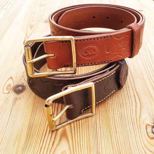 IMG 20210207 205834 386 Hand-crafted embossed leather belt. Made-to-measure from the finest English full grain leather. Hand-stitched. Choose from shotgun cartridge, horse, stag head, scope cross hairs, pheasant, stag jumping, duck or fish design. Leather colour: black, dark brown, chestnut, tan, or natural. Solid brass or nickel-plated buckle. Personalise - add embossed lettering for no additional cost. Eg, initials, name, nickname.