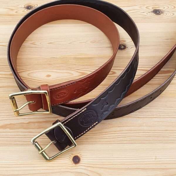 IMG 20210207 205834 419 Hand-crafted embossed leather belt. Made-to-measure from the finest English full grain leather. Hand-stitched. Choose from shotgun cartridge, horse, stag head, scope cross hairs, pheasant, stag jumping, duck or fish design. Leather colour: black, dark brown, chestnut, tan, or natural. Solid brass or nickel-plated buckle. Personalise - add embossed lettering for no additional cost. Eg, initials, name, nickname.