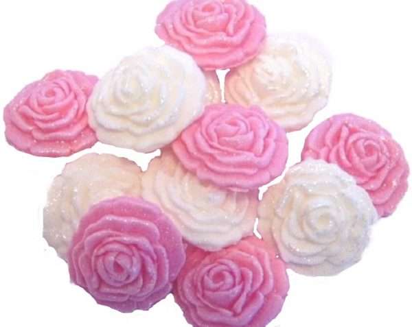 Inked12 Pink White Rosesjpeg LI This selection of edible small roses is shown in mixed sets, we do have them available in single colours under a separate listing. All are glittered and due to their size are extremely popular as cake fillers. These roses make Ideal cupcake and cake topper decorations for Weddings, Birthdays, Valentine and Anniversary. We hand make all our own decorations. Approx Size 2 cm