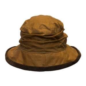 DIANA BEIGE BACK 300x300 1 Internal Lining is 100% Cotton lining, and an inner trim band for extra comfort. Outer Shell is made from 100% waxed cotton, making this hat waterproof. This traditional waxed cap has a corduroy trim around the ruffle style brim of the hat. Produced to the highest standards by a manufacturer of top qulaity countrywear and derby clothing