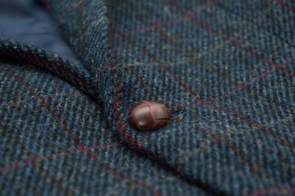 ROYAL BLUE BLAZER BUTTON These world famous Harris Tweed jackets, are superbly tailored, hard wearing and warm. When purchasing one of these jackets you are guaranteed exceptional quality. By law Harris Tweed must come from the Outer Hebrides, and be hand woven from local wool. Supplied by Harris Tweed Scotland from 100% pure virgin wool, dyed, spun and finished in the Western Isles of Scotland. Hand-woven by crofters in their own homes on the islands of Lewis, Harris, Uist and Barra. They are single breasted with two leather button fastening, and can be worn as a casual jacket or with a shirt and tie. Other specifications include side vents, two front pockets with flaps, Four interior pockets, three button leather cuff and Fully lined. Spare Button Leather buttons included. Dress with matching waistcoat for an extremely stylish look perfect for weddings and the races. All our tweeds are stamped with the authentic, official gold crossed orb mark of the Harris Tweed Authority.