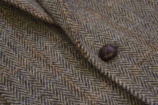 blazer button 1 These world famous Harris Tweed jackets are superbly tailored, hard-wearing and warm. When purchasing one of these jackets you are guaranteed exceptional quality. By law Harris Tweed must come from the Outer Hebrides, and be hand woven from local wool. Supplied by Harris Tweed Scotland from 100% pure virgin wool, dyed, spun and finished in the Western Isles of Scotland. Expertly hand-woven by crofters in their own homes on the islands of Lewis, Harris, Uist and Barra. They are single breasted with two leather button fastening, and can be worn as a casual jacket or with a shirt and tie. Other specifications include side vents, two front pockets with flaps, Four interior pockets, three button leather cuff and Fully lined. Spare Button Leather buttons included. Dress with matching waistcoat for an extremely stylish look perfect for weddings and the races. All our tweeds are stamped with the authentic, official gold crossed orb mark of the Harris Tweed Authority.