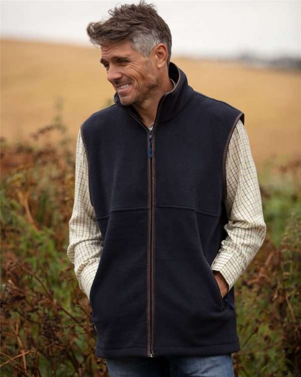 c03a6b17 e3e1 42ca 921e 190da200d416 Walker and Hawkes Hampton Fleece Gilet is constructed with antipilling fleece treatment - our Hampton Gilet is designed to keep wearers warm any time of the year, and is comfortable and practical to wear, making it the ideal choice for a wide range of outdoor and lifestyle uses Outer fabric (shell) is made from 330grm fleece. Other features include trims with Genuine Full Grain Leather Trims; adjustable drawcord at hem, 1-way heavy duty zip, two zipped pockets, with additional zip pullers. Produced to the highest standards by a manufacturer of top quality countrywear and derby clothing. Please check our size guide against your jacket you would like to purchase.