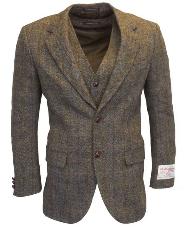 clinton brown blazer wc 1 These world famous Harris Tweed jackets, are superbly tailored, hard wearing and warm. When purchasing one of these jackets you are guaranteed exceptional quality. By law Harris Tweed must come from the Outer Hebrides, and be hand woven from local wool. Supplied by Harris Tweed Scotland from 100% pure virgin wool, dyed, spun and finished in the Western Isles of Scotland. Hand-woven by crofters in their own homes on the islands of Lewis, Harris, Uist and Barra. They are single breasted with two leather button fastening, and can be worn as a casual jacket or with a shirt and tie. Other specifications include side vents, two front pockets with flaps, Four interior pockets, three button leather cuff and Fully lined. Spare Button Leather buttons included. Dress with matching waistcoat for an extremely stylish look perfect for weddings and the races. All our tweeds are stamped with the authentic, official gold crossed orb mark of the Harris Tweed Authority.