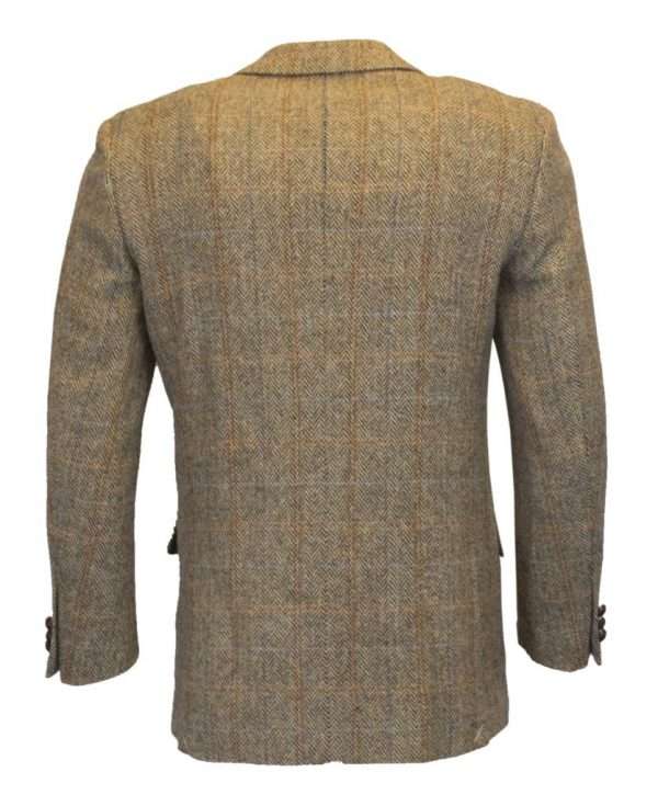 white sand blazer back 1 These world famous Harris Tweed jackets are superbly tailored, hard-wearing and warm. When purchasing one of these jackets you are guaranteed exceptional quality. By law Harris Tweed must come from the Outer Hebrides, and be hand woven from local wool. Supplied by Harris Tweed Scotland from 100% pure virgin wool, dyed, spun and finished in the Western Isles of Scotland. Expertly hand-woven by crofters in their own homes on the islands of Lewis, Harris, Uist and Barra. They are single breasted with two leather button fastening, and can be worn as a casual jacket or with a shirt and tie. Other specifications include side vents, two front pockets with flaps, Four interior pockets, three button leather cuff and Fully lined. Spare Button Leather buttons included. Dress with matching waistcoat for an extremely stylish look perfect for weddings and the races. All our tweeds are stamped with the authentic, official gold crossed orb mark of the Harris Tweed Authority.
