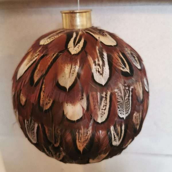 Beautiful carefully handcrafted baubles . Made using only the finest Ringneck Hen Pheasant Feathers to create something stunning. Available as either Cock or Hen.