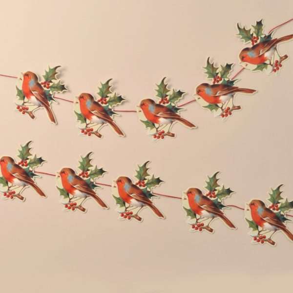R23 If you're looking to add that special something to your festive celebrations, Mamelok garlands create a sense of the traditional Victorian Christmas. This beautiful garland features ten repeated motifs of a robin with holly. Manufactured and hand finished with love in the United Kingdom, our garlands are all printed on high-quality card before being diecut and embossed to highlight the nuances of the image. Each garland comes strung and ready to hang along your mantelpiece, feature wall or staircase and measures approximately 3m x 175mm. Free postage and packing.