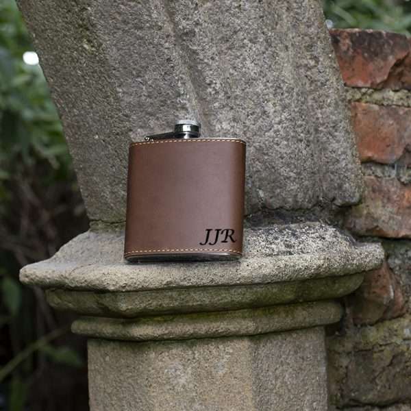 brown flask wombat <p style="background: white;vertical-align: top;margin: 0cm 0cm 13.5pt 0cm"><span style="font-size: 12.0pt;font-family: 'Arial',sans-serif;color: #555555">Made from stainless steel and covered in luxury English hide leather.</span></p> Personalisation max 3 characters Choice of Times New Roman or Lucida Calligraphy Fonts