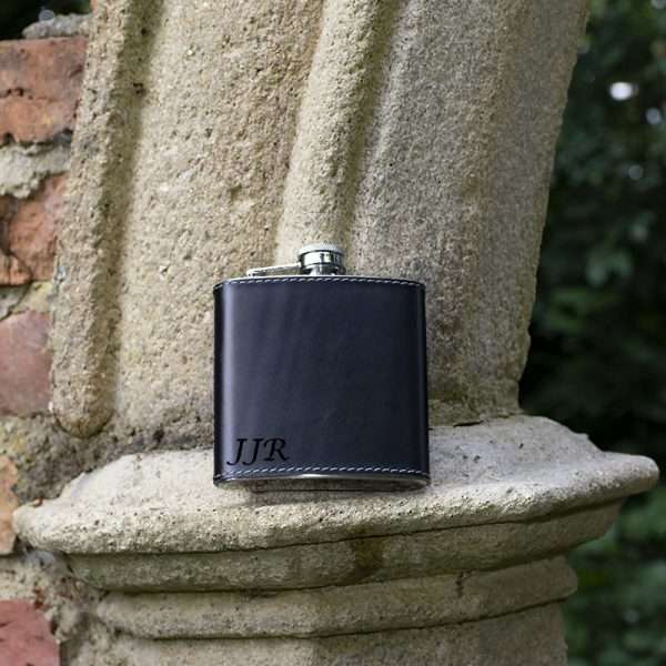 wombat black leather hip flask <p style="background: white;vertical-align: top;margin: 0cm 0cm 13.5pt 0cm"><span style="font-size: 12.0pt;font-family: 'Arial',sans-serif;color: #555555">Made from stainless steel and covered in luxury English hide leather.</span></p> Personalisation max 3 characters Choice of Times New Roman or Lucida Calligraphy Fonts