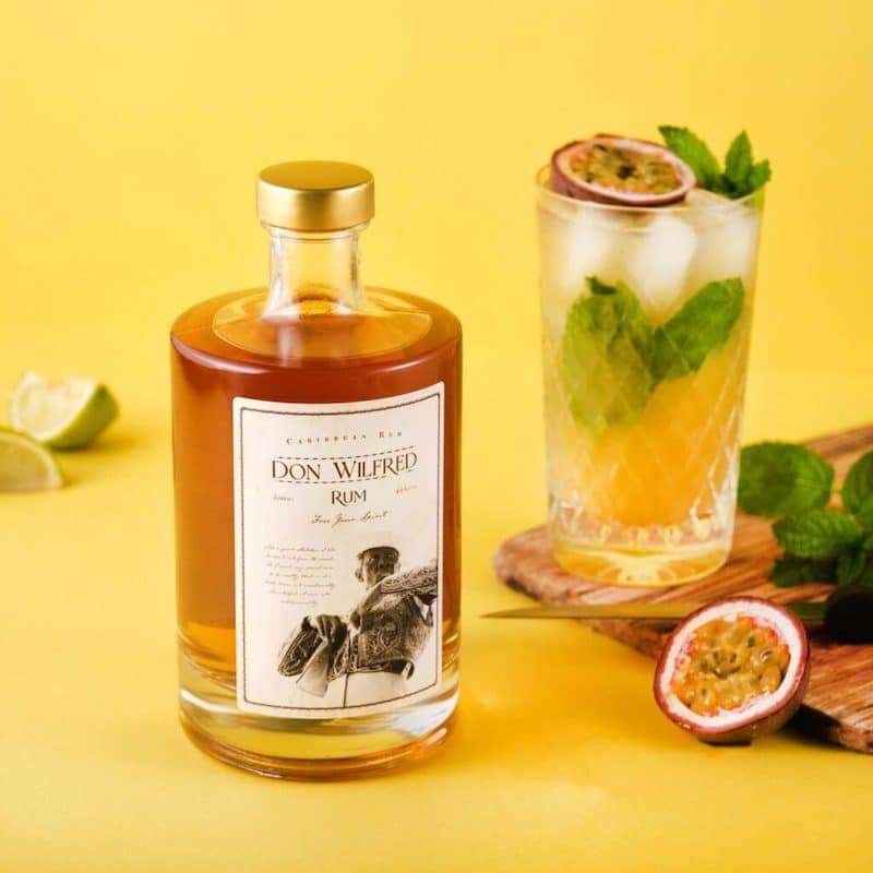 TBF Rum2192 1 scaled 1 1024x1024 1 AGE RESTRICTED 18+ only <p class="x_MsoNormal">Don Wilfred Rum has been made to encapsulate all that Caribbean rum has to offer. With hints of orange and tropical fruits it is bound to transport you to the white sandy beaches of the Caribbean. To immerse yourself in the experience simply add fresh lime and your favourite cola or ginger beer – or if you prefer it straight, simply add ice.</p> <p class="x_MsoNormal">My rum is blended from the pick of Caribbean rum producers.  This golden spirit is 40% ABV and certainly packs a punch.</p>  