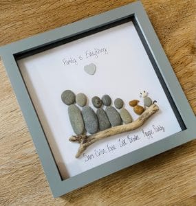 f2 PLEASE NOTE COST VARIES FOR THE SIZE OF THE FRAME AND AMOUNT OF CHARACTERS. Hi my name is Sarah Jackson. Thank you for visiting my little shop! I am a small business with just me (at the moment) and I custom make everything in my shop by hand with love, care and attention to detail - all made to order. I hope you like the items as much as I love making them! *The Description* This Gift is created with the utmost care and attention to detail and presented in a 21x21cm box frame, this beautiful Frame is for up to 5 characters (including pets) includes mount and any embellishments such as Paw Prints for pets if required, I have also added small wings for lost babies, and Pebble Dogs, Cats, Butterflies Horses, Hamsters, Rabbits, Frogs and even pebble chinchilla's. They also feature handpicked Driftwood from the beach or woods.. Please put ages of any kids featured please and colours of pets, dogs and cats...and let me know which image you like from the listing if you have one. Larger groups are also available to purchase in the options with larger frames too. Any further questions please click contact seller and I’ll be more than happy to help :-) Upon purchase please add all names/words and click number of pebble people/pets you’d like (adults and children) and add child AGES in an email so I can size the pebbles correctly. I will send a picture before posting to proof, so upon purchase please keep an eye on your mailbox for this. Once a proof has been sent - you will have 2 hours to approve this, so as not to delay dispatch. After this time any changes made by you, (not corrections) may incur an additional cost. *The Dispatch Time* Usual turn around is 5-7 working days however if it is more urgent please let me know. At busier times this may be slightly longer. *Delivery* I have a standard delivery time however, if you need your item by an earlier date please let me know when ordering. I use first/second class royal mail postage, with basic departure and arrival tracking. But you can upgrade to a fully tracked service in the postage options if you wish. I have a Speedy Delivery which will speed the dispatch up but this will NOT be available at busy times such as Mothers Day, Fathers Day or Christmas. Having said this please do message me first as I may be able to accommodate you. Many thanks for supporting my local small business and please do message me with any questions. Please also find me on Facebook and Instagram and give me a follow if you can, where you will get updates on new products, discount sales and more. www.Facebook.com/youvebeenframedbysj Www.Instagram.com/youvebeenframedbysj Many thanks again Sarah xx