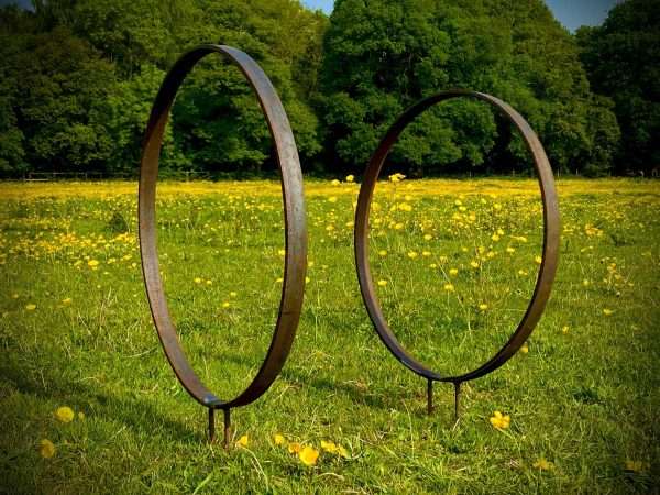 WELCOME TO THE RUSTIC GARDEN ART SHOP Here we have one of our. Rustic Metal Garden Ring Hoop Sculpture - Pair of Rusty Ring Circle Garden Art / Globe / Sphere Interchangeable metal ring sculptures - one is slightly smaller so fits within the other ring with two stakes per ring. Enabling you to arrange your own formation or design. These two rustic garden rings make a unique, versatile garden sculpture. Arrange the rusty metal rings in any formation to create your very own unique piece of affordable garden decor. Our Rustic/Rusty patina gives a natural and unique finish, which will continue to better with age. Our rustic garden art products require absolutely no maintenance! Sizes & Measurements:
Medium: approx 50cm diameter - made from flat steel 30mm x 8mm