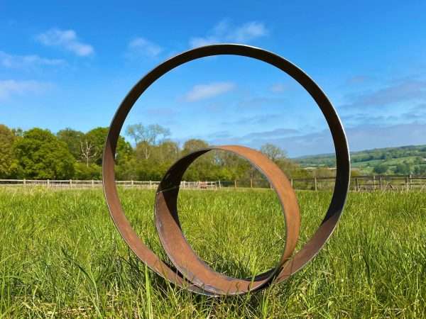 WELCOME TO THE RUSTIC GARDEN ART SHOP Here we have one of our. Rustic Garden Metal Hoop Ring Art Sculpture Sizes & Measurements:
52cm x 52cm (excluding prongs) Ring:
9cm width x 3mm thick Perfect For Any Garden Or Outdoor Space.
All of our garden stake art come with garden stakes affixed or prongs enabling a quick & easy install!