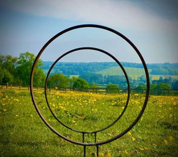 WELCOME TO THE RUSTIC GARDEN ART SHOP Here we have one of our. Rustic Metal Garden Ring Hoop Sculpture - Pair of Rusty Ring Circle Garden Art / Globe / Sphere Interchangeable metal ring sculptures - one is slightly smaller so fits within the other ring with two stakes per ring. Enabling you to arrange your own formation or design. These two rustic garden rings make a unique, versatile garden sculpture. Arrange the rusty metal rings in any formation to create your very own unique piece of affordable garden decor. Our Rustic/Rusty patina gives a natural and unique finish, which will continue to better with age. Our rustic garden art products require absolutely no maintenance! Sizes & Measurements:
Medium: approx 50cm diameter - made from flat steel 30mm x 8mm