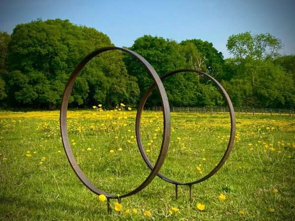 WELCOME TO THE RUSTIC GARDEN ART SHOP Here we have one of our. Rustic Metal Garden Ring Hoop Sculpture - Pair of Rusty Ring Circle Garden Art / Globe / Sphere Interchangeable metal ring sculptures - one is slightly smaller so fits within the other ring with two stakes per ring. Enabling you to arrange your own formation or design. These two rustic garden rings make a unique, versatile garden sculpture. Arrange the rusty metal rings in any formation to create your very own unique piece of affordable garden decor. Our Rustic/Rusty patina gives a natural and unique finish, which will continue to better with age. Our rustic garden art products require absolutely no maintenance! Sizes & Measurements:
Medium: approx 50cm diameter - made from flat steel 30mm x 8mm