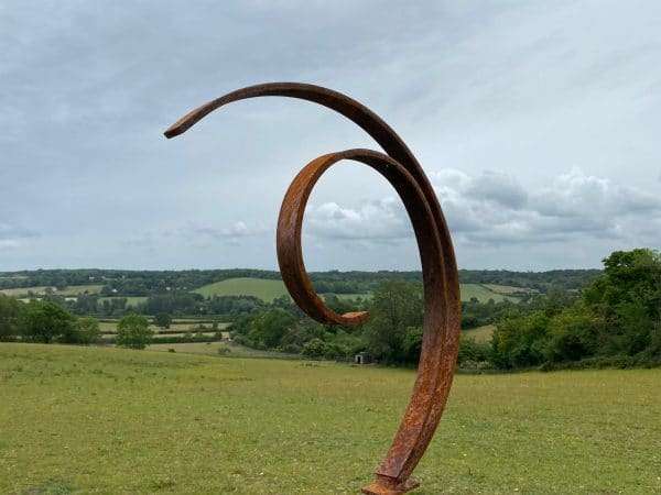 WELCOME TO THE RUSTIC GARDEN ART SHOP Here we have one of our. Rustic Metal Garden Art Abstract Flowing Swirl Metal Ring Sculpture Scroll Sphere Arched Yard Art Gift Arched metal 3/4 ring sculptures - one is slightly smaller so fits within the other ring with a base plate & ground stake These two rustic garden arches make a unique, versatile garden sculpture. Our Rustic/Rusty patina gives a natural and unique finish, which will continue to better with age. Our rustic garden art products require absolutely no maintenance! Sizes & Measurements:
Medium: approx 50cm x 60cm x 15cm