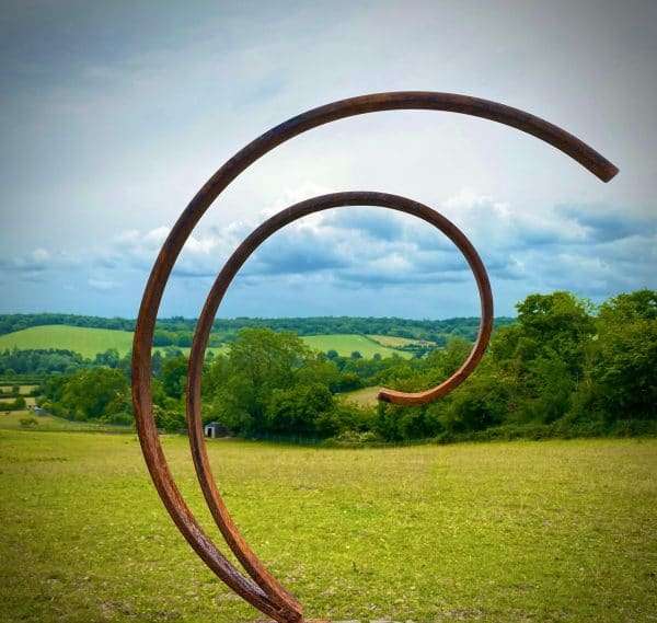 WELCOME TO THE RUSTIC GARDEN ART SHOP Here we have one of our. Rustic Metal Garden Art Abstract Flowing Swirl Metal Ring Sculpture Scroll Sphere Arched Yard Art Gift Arched metal 3/4 ring sculptures - one is slightly smaller so fits within the other ring with a base plate & ground stake These two rustic garden arches make a unique, versatile garden sculpture. Our Rustic/Rusty patina gives a natural and unique finish, which will continue to better with age. Our rustic garden art products require absolutely no maintenance! Sizes & Measurements:
Medium: approx 50cm x 60cm x 15cm