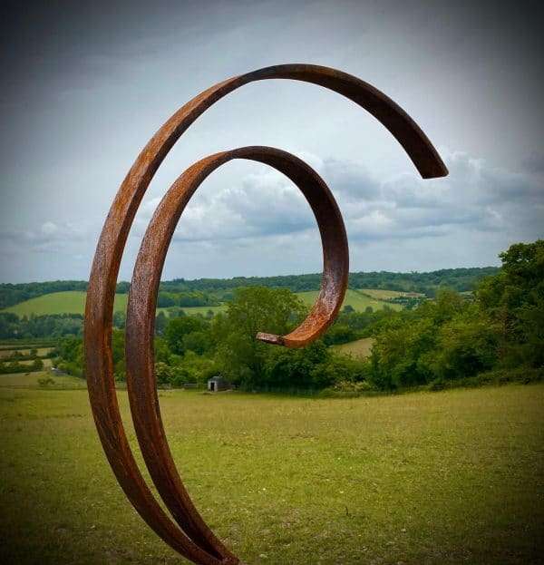 WELCOME TO THE RUSTIC GARDEN ART SHOP Here we have one of our. Rustic Metal Garden Art Abstract Flowing Swirl Metal Ring Sculpture Scroll Sphere Arched Yard Art Gift Arched metal 3/4 ring sculptures - one is slightly smaller so fits within the other ring with a base plate & ground stake These two rustic garden arches make a unique, versatile garden sculpture. Our Rustic/Rusty patina gives a natural and unique finish, which will continue to better with age. Our rustic garden art products require absolutely no maintenance! Sizes & Measurements:
Medium: approx 50cm x 60cm x 15cm