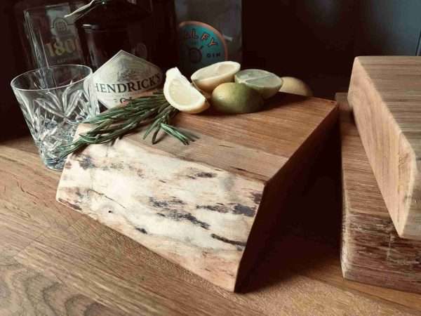 GT Block scaled Our funky, chunky cutting blocks are the perfect accompaniment to your mixology equipment collection. All blocks are solid, natural edged hardwoods from a selection of oak, cherry, elm and others, and all are entirely individual.