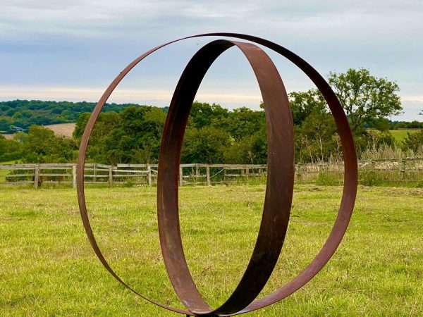 WELCOME TO THE RUSTIC GARDEN ART SHOP Here we have one of our. Rustic Metal Wide Garden Ring Hoop Sculpture - Pair of Rusty Ring Circle Garden Art / Globe / Sphere Interchangeable metal ring sculptures - one is slightly smaller so fits within the other ring with two stakes per ring. Enabling you to arrange your own formation or design. These two rustic garden rings make a unique, versatile garden sculpture. Arrange the rusty metal rings in any formation to create your very own unique piece of affordable garden decor. Our Rustic/Rusty patina gives a natural and unique finish, which will continue to better with age. Our rustic garden art products require absolutely no maintenance! Sizes & Measurements:
Medium - Approx 50cm diameter -made from flat steel 90mm wide