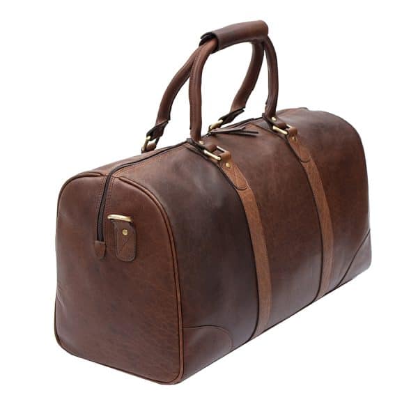 9001col w3 The Wombat Luxury Holdall is a chic and stylish holdall that comes in a rich, beautiful brown color. Its soft, supple leather gives you a luxurious look and feel that is unmatched.  This holdall’s best feature is the unbelievable leather quality. It’s made from oiled leather that is very thick that can stand up to anything you can throw at it.