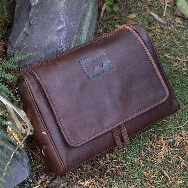 9007 1 cc store Keep your toiletries together in style with this durable yet classy wash-bag, made from dark brown oiled leather. With plenty of zipped pockets and storage options, it’s the ideal travel accessory. Hang it on the door for a practical and elegant way to save space in your bathroom. Perfect for both summer and winter trips.! Optional Personalisation
