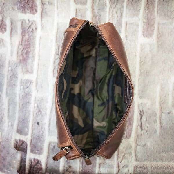 9007col w5 Keep your toiletries together in style with this durable yet classy wash-bag, made from dark brown oiled leather. With plenty of zipped pockets and storage options, it’s the ideal travel accessory. Hang it on the door for a practical and elegant way to save space in your bathroom. Perfect for both summer and winter trips.! Optional Personalisation