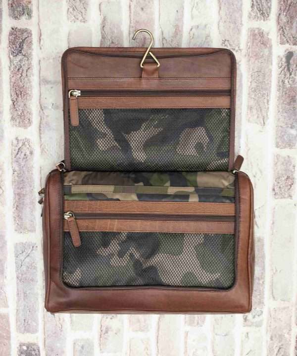 bag l logo 4 copy scaled Keep your toiletries together in style with this durable yet classy wash-bag, made from dark brown oiled leather. With plenty of zipped pockets and storage options, it’s the ideal travel accessory. Hang it on the door for a practical and elegant way to save space in your bathroom. Perfect for both summer and winter trips.! Optional Personalisation