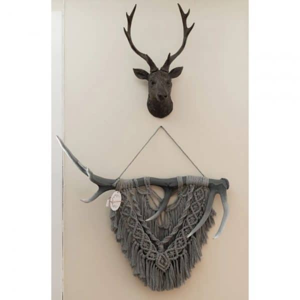 Large layered macrame wall hanging on stag antler