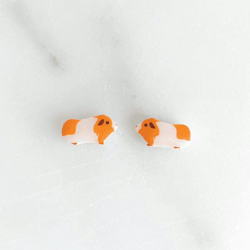 gold and white guinea pig earrings