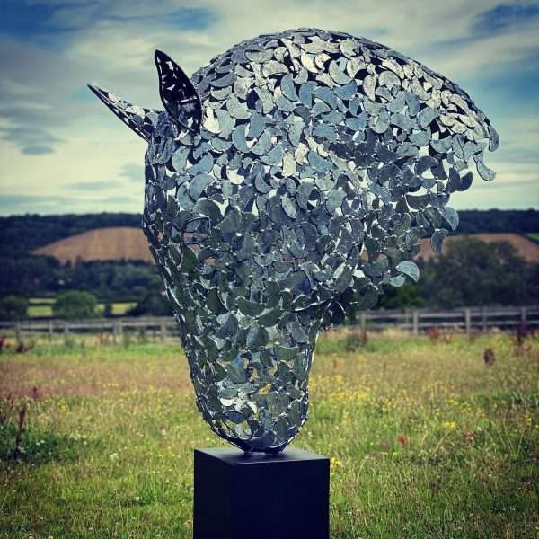 0ABB4E62 5860 4411 A6EB 22A660F3B46F 4 Metre Horse Head Equine Sculpture by British Sculptor Charles Elliott - Handcrafted using plate steel shapes Finished in a luxurious zinc galvanise to last a lifetime, mounted on a black steel plinth. Illumination kits availvale for this scuplture.   Sitting at a total height of 4 metres. A choice of plinths finished in a colour to suit.   Horse Head Sculpture Sizes Prices: 6m - £POA +VAT 4m - £POA +VAT 2m - £11500 +VAT 1.2m - £8000 +VAT   All Enquiries Welcome Worldwide Shipping & Installation Available   We Welcome Studio Visits - By Appointment Only www.elliottoflondon.co.uk info@elliottoflondon.co.uk 01494 758 896