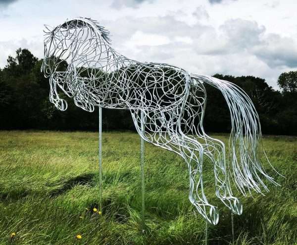 Blue Memory Jumping Horse Sculpture Gallery 6 SOLD ALL COMMISSIONS WELCOME   Our NEW Jumping Horse Sculpture ‘Blue Memory’ By British Sculptor Charles Elliott was inspired by the late World Champion jumping stallion Plot Blue, ridden by Marcus Ehning- When creating each sculpture, Charles uses inspiration from various horses, studying characteristics and proportions. Whilst putting his finishing touches to this Plot Blue inspired sculpture, we were shocked to receive news of his passing. ‘Blue Memory’ Sculpture will be on show at Bolesworth International Horse Show and Al’Shiara Hickstead Derby & Nation Cups in 2019 - This Handcrafted Life Size Jumping Horse Sculpture forms the latest one off sculpture of The Elliott of London Equestrian Sculpture Range. Handmade from 8mm round mild steel to indicate power and flow, luxurious progressive zinc exterior galvanised finish to protect the piece from nature and rust for over 30 years! Worldwide Shipping and International Delivery & Installation Available! All Enquiries Welcome - Available to Buy, as well as long term and short term hire! Approx Dimensions L= 340cm H= 280cm W= 70cm Studio Office - 01494758896 Charles - 07591730415 Website: www.elliottoflondon.co.uk Email:info@elliottoflondon.co.uk Viewing Welcome by Appointment only