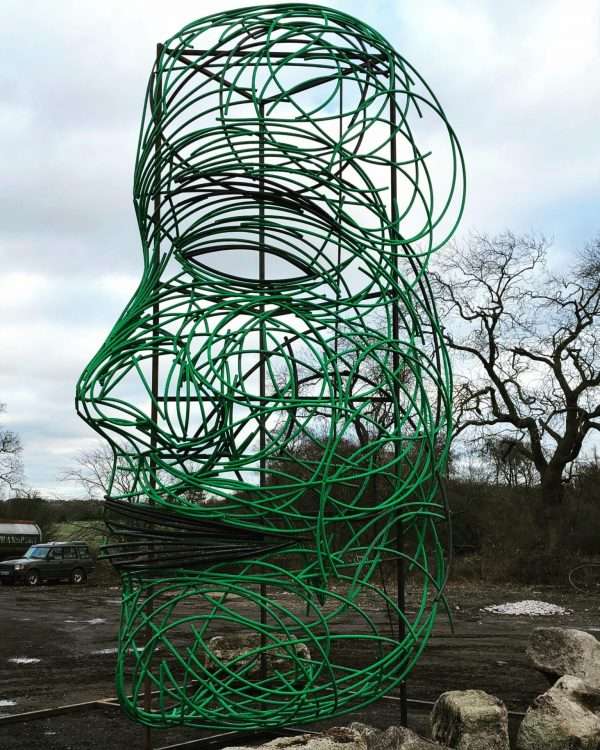 FACING FEARS SCULPTURE Gallery 2 Elliott of London 'Facing Fears'   By British Sculptor Charles Elliott This 9 Metres high abstract face sculpture was designed and handcrafted by Charles from recycled plastic tubes. Created in response to national fears of 2018, with Brexit and various other environmental issues surrounding global warming and Plastic Recycling. At present Recycling Markets send 500,000 tons of plastic a year to China to be recycled, which has been stopped as of 1st January 2018. This poses various issues to the UK Recycling Industry.   This large powerful and controversial sculpture can be seen on show outside Elliott of London NEW Berkhamsted Based Sculpture Studio next to A41. Charles and his team welcome visitors to see and picture the piece safely from their premises!   Studio Office - 01494758896 Charles - 07591730415 Website: www.elliottoflondon.co.uk Email: info@elliottoflondon.co.uk   #recycling #plasticrecycling #recycleplastic #ukrecycling #sculpture #artist #britishsculptor #charleselliott #humanface #faceart #femaleface #figurative #britishsculpture #abstractart #abstractsculpture #contraversial #globalwarming #enviromentalissues #recycledart #upcycled #upcycling #reuseable #renewable #waste #scrapplastics #hdpe #siliconeplastic