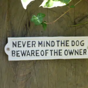 Cast iron Never Mind The Dog Sign