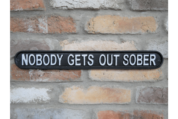 Cast iron nobody gets out sober sign