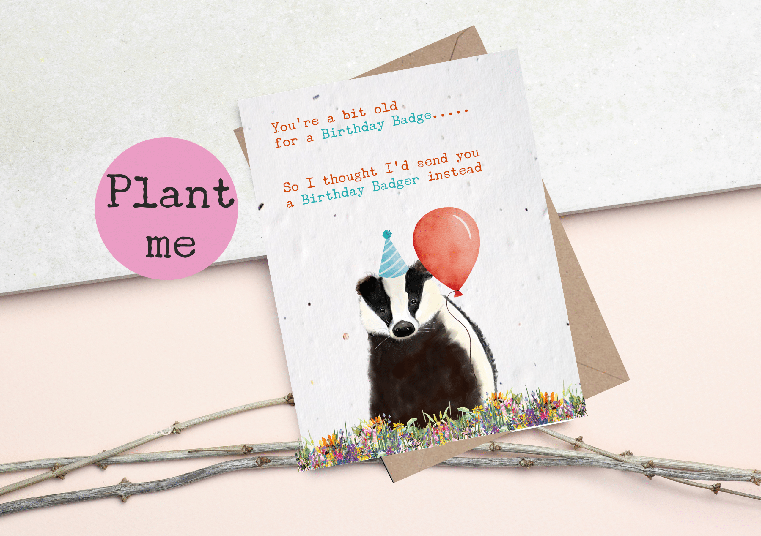 Plantable seed card featuring a cute hand drawn badger with a party hat and balloon- card reads, You're a bit old for a birthday badge, so i thought i'd send you a birthday badger instead. Plant the card to grow wildflowers.
